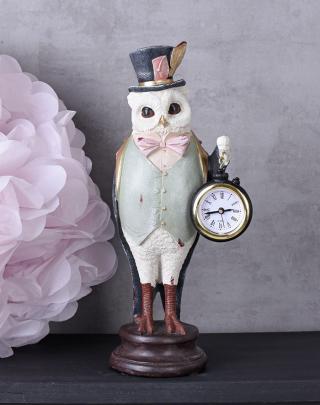 biała sowa figura fantasy z zegarkiem