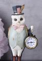 biała sowa figura fantasy z zegarkiem