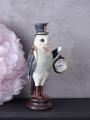 biała sowa figura fantasy z zegarkiem